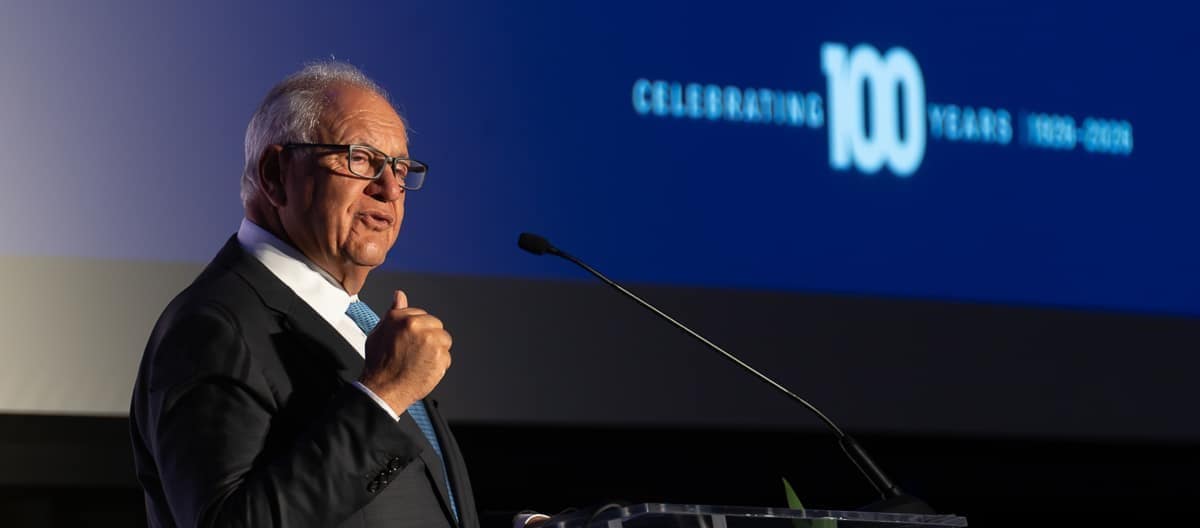 Embry‑Riddle Board of Trustees Chairman Mori Hosseini speaks at the university’s centennial event on March 26, at the Daytona Beach Campus